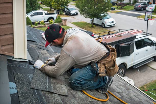 Professional Roofing technician working in Farmland, IN